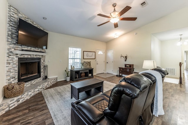 50 Canary St, Point Blank, TX 77364 - living area featuring dark wood-style flooring, ceiling fan, a stone fireplace, vaulted ceiling, and baseboards