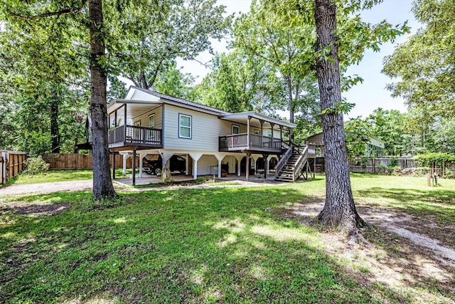 50 Canary St, Point Blank, TX 77364 - back of property featuring stairway and a wooden deck