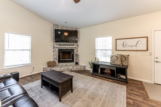 50 Canary St, Point Blank, TX 77364 - living room featuring vaulted ceiling, wood finished floors, a fireplace, ceiling fan, and baseboards