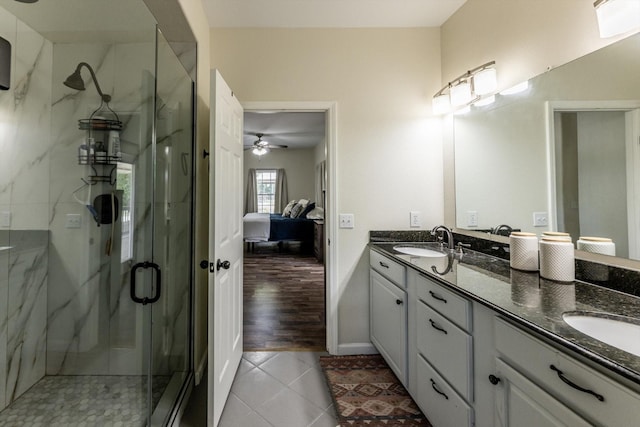 50 Canary St, Point Blank, TX 77364 - ensuite bathroom featuring double vanity, a marble finish shower, tile patterned flooring, and a ceiling fan