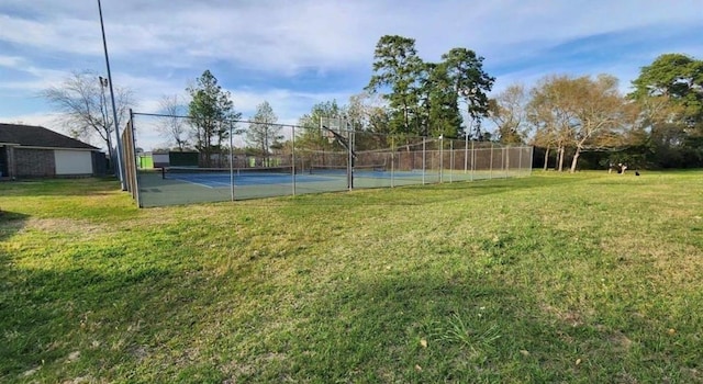 12622 Pine Bough Ln, Cypress, TX 77429 - view of tennis court featuring a lawn and fence