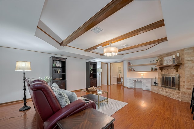 12622 Pine Bough Ln, Cypress, TX 77429 - living room featuring light wood-style floors, baseboards, beamed ceiling, and visible vents