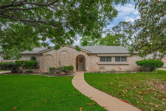 12622 Pine Bough Ln, Cypress, TX 77429 - view of front facade with brick siding, a shingled roof, and a front yard