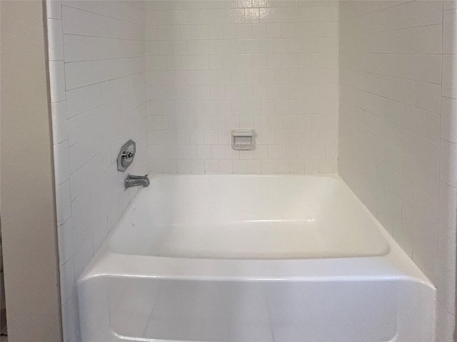 full bathroom with a bathtub and a shower