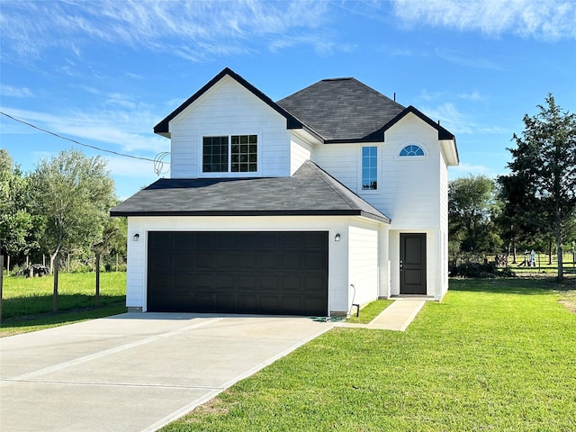 view of front of property with an attached garage, a shingled roof, concrete driveway, and a front yard