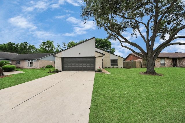 view of side of property with an attached garage, driveway, and brick siding