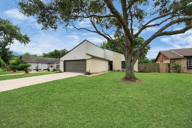 view of front facade with driveway, brick siding, and a garage