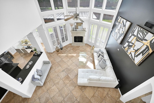 2703 Marble Brook Ln, Pearland, TX 77584 - living room with a wealth of natural light, ceiling fan, a high ceiling, and stone tile floors