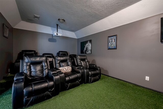 2703 Marble Brook Ln, Pearland, TX 77584 - carpeted home theater room featuring visible vents, a textured ceiling, and baseboards