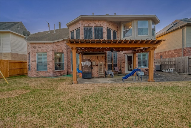 2703 Marble Brook Ln, Pearland, TX 77584 - back of property featuring a fenced backyard, a patio area, and brick siding