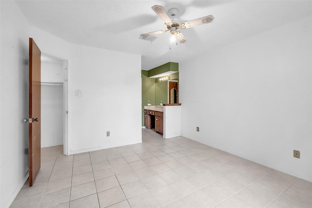 6803 Lakemont Dr, Houston, TX 77050 - unfurnished bedroom featuring light tile patterned floors, ceiling fan, and ensuite bathroom