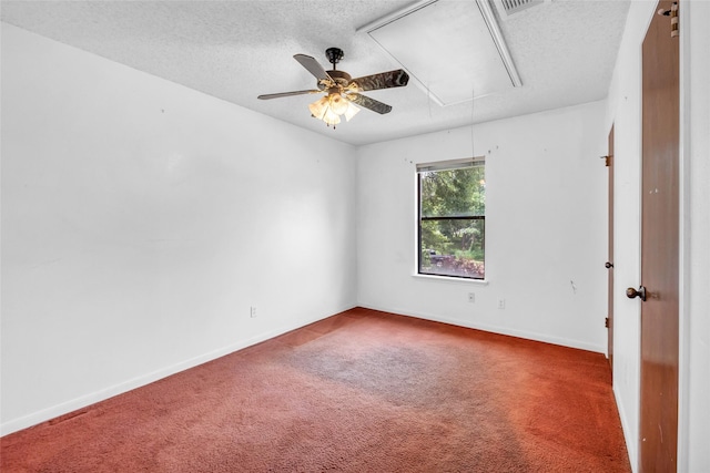 6803 Lakemont Dr, Houston, TX 77050 - carpeted empty room with baseboards, a ceiling fan, attic access, and a textured ceiling