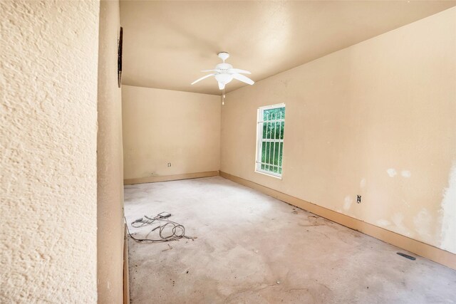 6803 Lakemont Dr, Houston, TX 77050 - spare room with ceiling fan, baseboards, and unfinished concrete floors