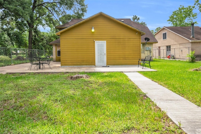 6803 Lakemont Dr, Houston, TX 77050 - back of house with a yard, fence, and a patio area
