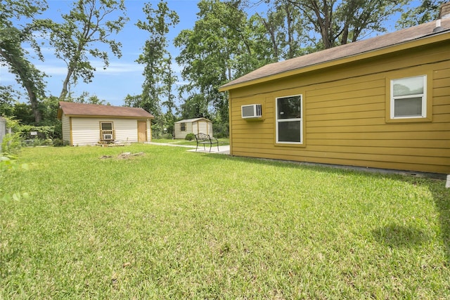 6803 Lakemont Dr, Houston, TX 77050 - view of yard with an outdoor structure and a wall mounted air conditioner