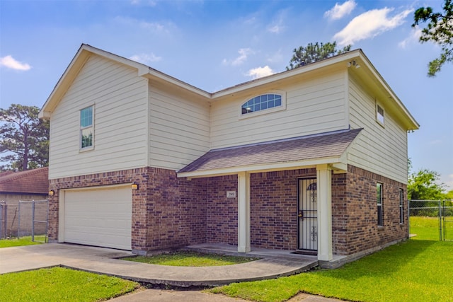 traditional home with brick siding, driveway, an attached garage, and a shingled roof