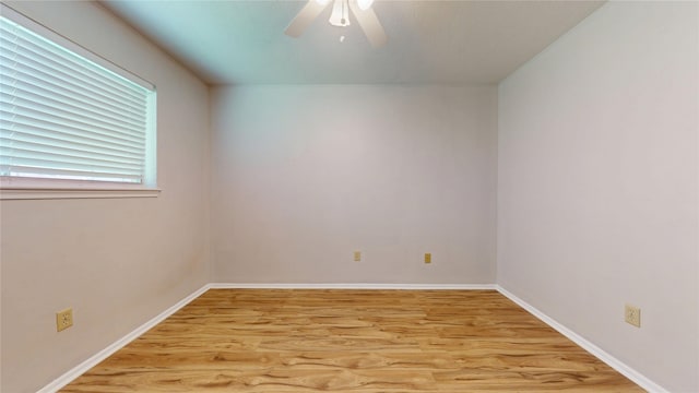 unfurnished room with baseboards, ceiling fan, and light wood finished floors