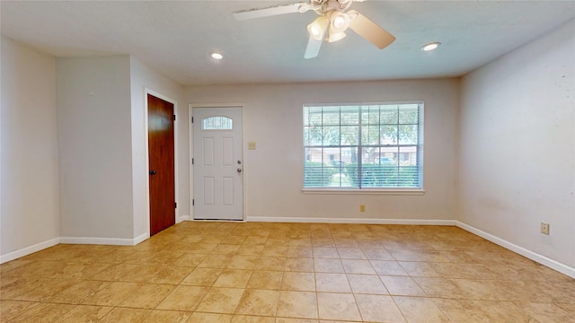 entryway featuring baseboards, recessed lighting, ceiling fan, and light tile patterned flooring