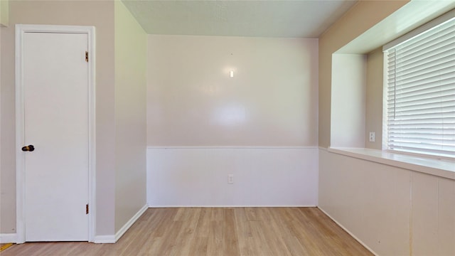 spare room with light wood finished floors