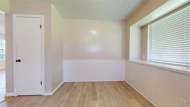 spare room with light wood-type flooring