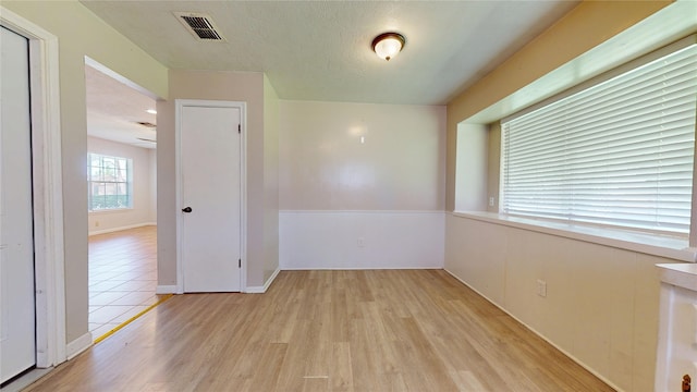 spare room with visible vents and light wood-style floors