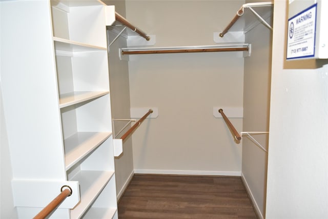 11111 Sprucedale Ct, Houston, TX 77070 - walk in closet featuring dark wood-style flooring