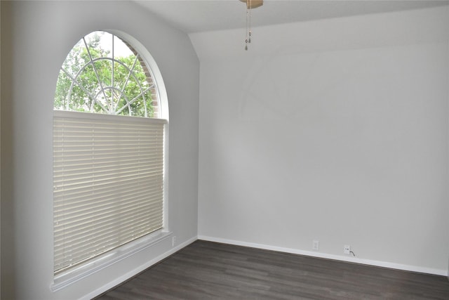 11111 Sprucedale Ct, Houston, TX 77070 - empty room with dark wood-type flooring, baseboards, and lofted ceiling