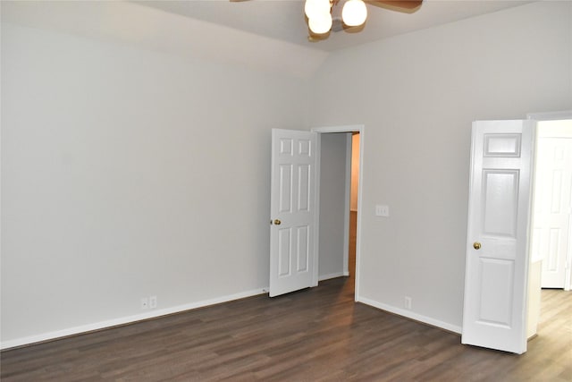 11111 Sprucedale Ct, Houston, TX 77070 - unfurnished bedroom with a ceiling fan, baseboards, vaulted ceiling, and dark wood-type flooring