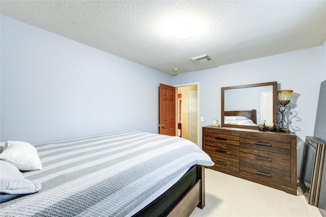 10338 E Summit Canyon Dr, Houston, TX 77095 - bedroom with light colored carpet, a textured ceiling, and visible vents
