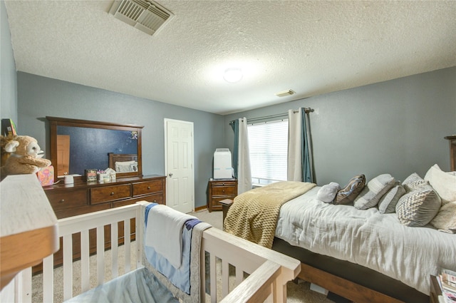 10338 E Summit Canyon Dr, Houston, TX 77095 - carpeted bedroom with a textured ceiling and visible vents