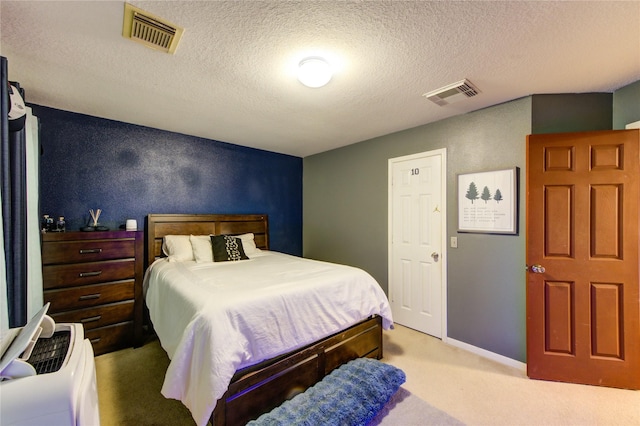 10338 E Summit Canyon Dr, Houston, TX 77095 - bedroom with carpet, a textured ceiling, and visible vents