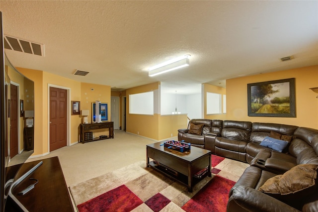 10338 E Summit Canyon Dr, Houston, TX 77095 - living area featuring carpet floors, a textured ceiling, and visible vents