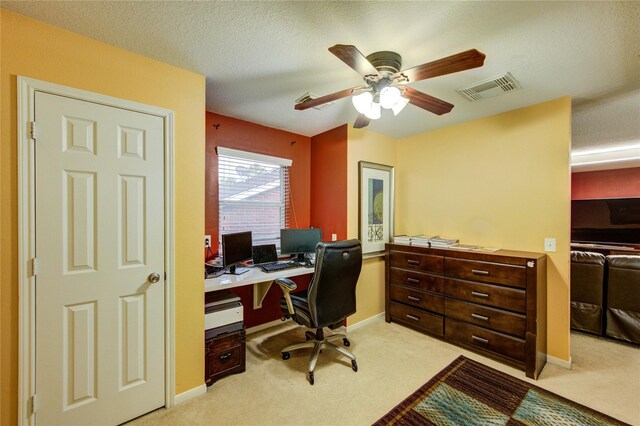 10338 E Summit Canyon Dr, Houston, TX 77095 - office area featuring a ceiling fan, a textured ceiling, visible vents, baseboards, and light carpet
