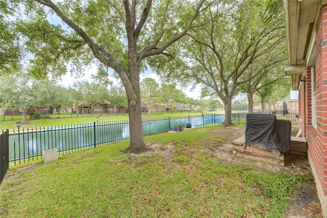 10338 E Summit Canyon Dr, Houston, TX 77095 - view of yard with a fenced backyard and a water view