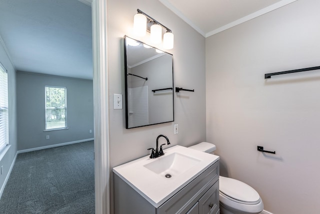 bathroom featuring crown molding, toilet, baseboards, and vanity