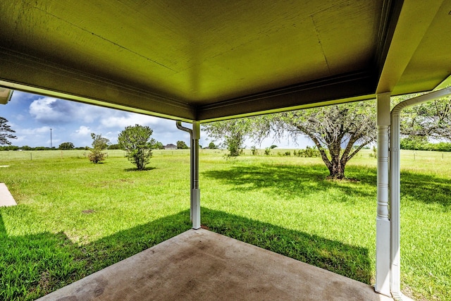 view of yard featuring a patio and a rural view