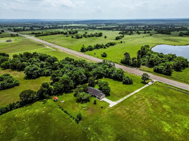 bird's eye view with a water view and a rural view