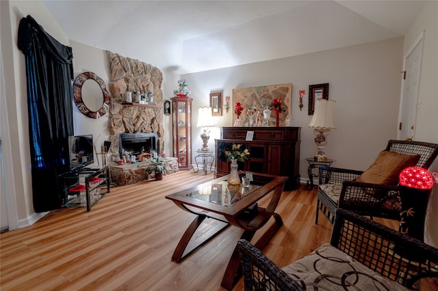 living area featuring wood finished floors and lofted ceiling