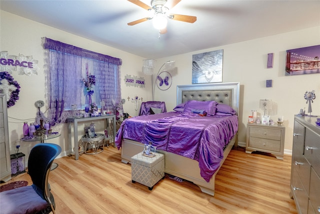 bedroom with baseboards, light wood finished floors, and ceiling fan