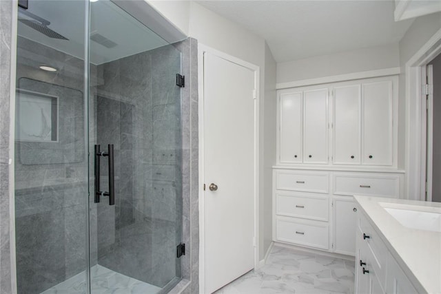 bathroom with vanity, a shower stall, and marble finish floor