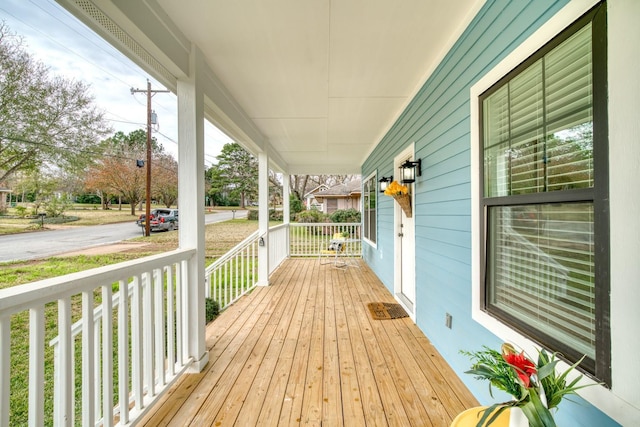 wooden terrace with a porch