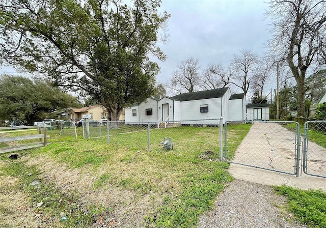 1827 Neuman St, La Marque, TX 77568 - exterior space featuring fence, a gate, and a front yard