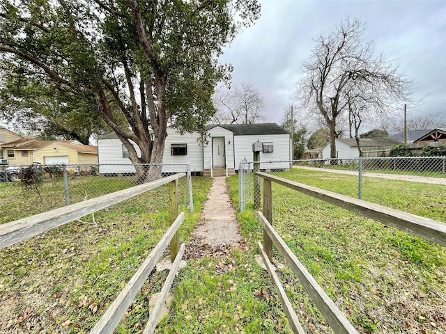 1827 Neuman St, La Marque, TX 77568 - bungalow-style house with a fenced front yard and a front lawn