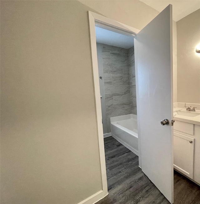 1827 Neuman St, La Marque, TX 77568 - full bathroom with vanity, baseboards, and wood finished floors