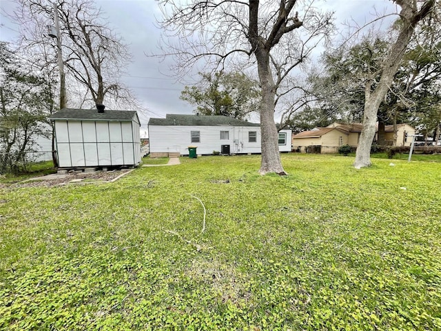 1827 Neuman St, La Marque, TX 77568 - view of yard with an outbuilding and a storage shed