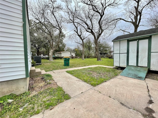 1827 Neuman St, La Marque, TX 77568 - view of yard featuring central AC and an outbuilding