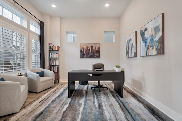 office featuring baseboards, recessed lighting, and wood finished floors
