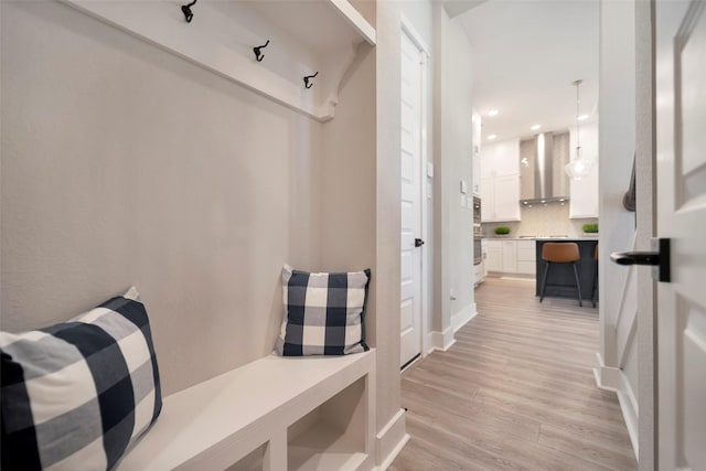 mudroom with recessed lighting and light wood-style flooring