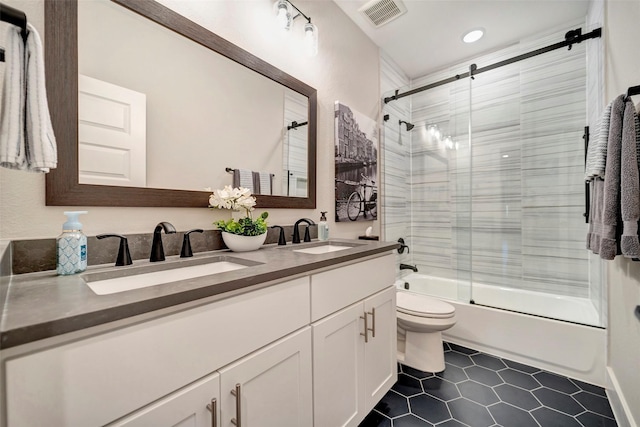 full bath featuring shower / bath combination with glass door, toilet, visible vents, and a sink