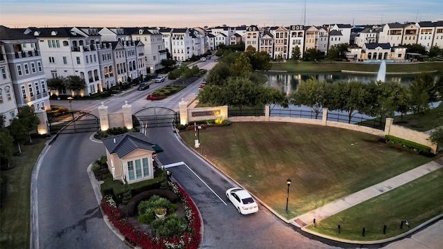aerial view featuring a water view and a residential view